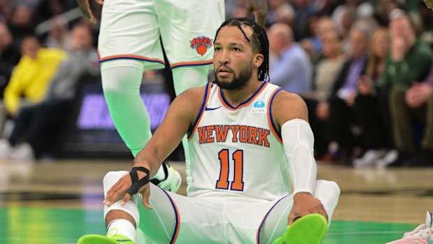 Nov 3, 2023; Milwaukee, Wisconsin, USA; New York Knicks guard Jalen Brunson (11) sits after being fouled in the fourth quarter against the Milwaukee Bucks at Fiserv Forum.